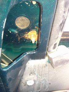 The final of three nuts holding my mirror in place, too rusty to turn and to awkward to get leverage.  Got a deep 10mm socket I can borrow?